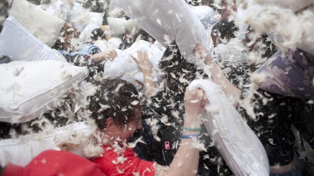 Teenager pillow fighting